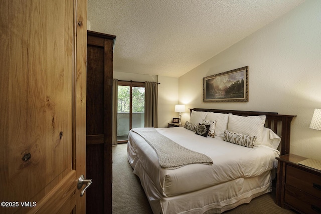 531 E Lionshead Cir Unit 303, Vail, CO 81657 - bedroom featuring dark carpet, a textured ceiling, lofted ceiling, and access to exterior
