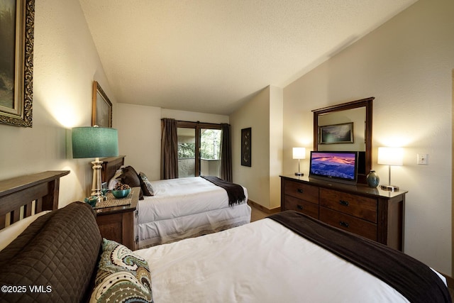 531 E Lionshead Cir Unit 303, Vail, CO 81657 - bedroom with lofted ceiling and baseboards