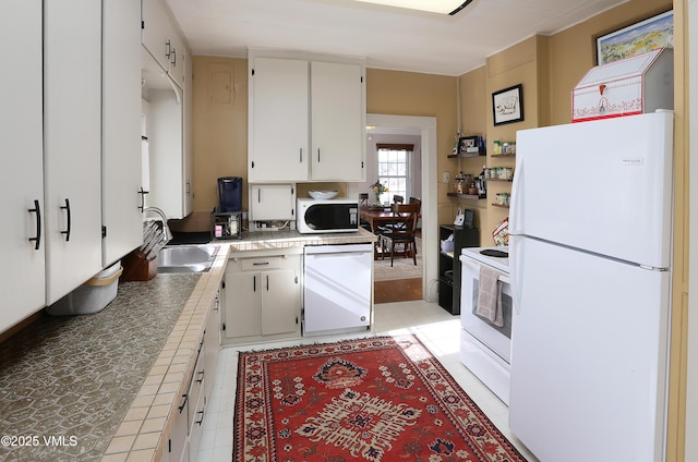 546 Grand Ave, Eagle, CO 81631 - kitchen featuring tile counters, white appliances, white cabinetry, light tile patterned flooring, and a sink