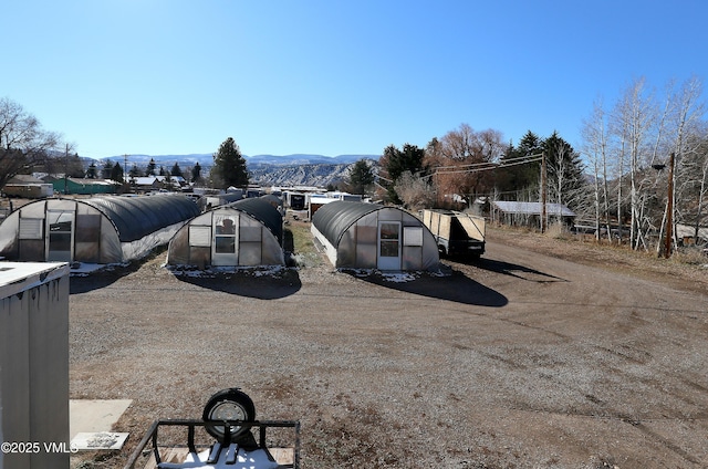 546 Grand Ave, Eagle, CO 81631 - exterior space with a mountain view, an outdoor structure, and a greenhouse