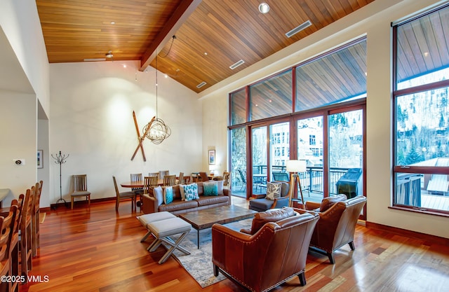 1325 Westhaven Dr Unit A302, Vail, CO 81657 - living room with plenty of natural light, high vaulted ceiling, wood finished floors, a wood ceiling with exposed beams, and a chandelier