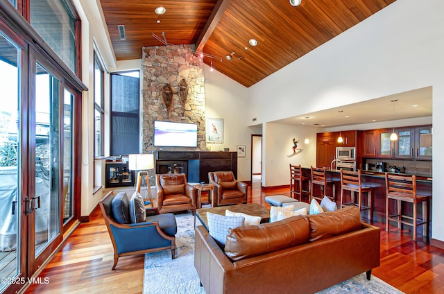 1325 Westhaven Dr Unit A302, Vail, CO 81657 - living room featuring light wood-type flooring, a wooden ceiling with exposed beams, high vaulted ceiling, and recessed lighting