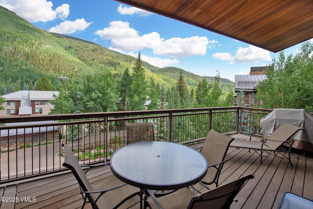 1325 Westhaven Dr Unit A302, Vail, CO 81657 - wooden terrace with a mountain view, area for grilling, and a view of trees