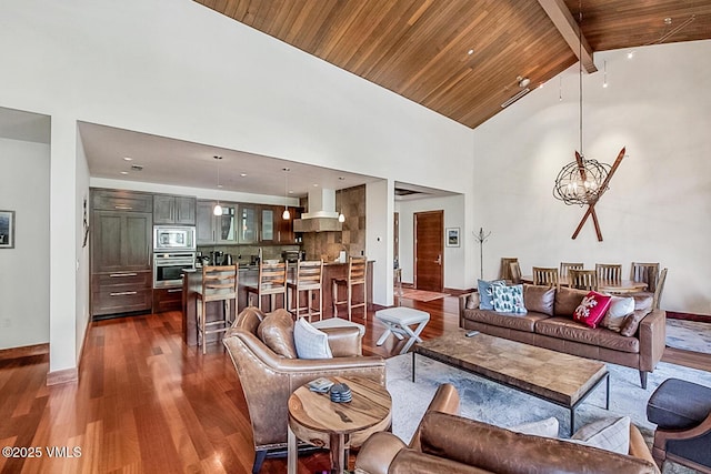 1325 Westhaven Dr Unit A302, Vail, CO 81657 - living area with dark wood-style flooring, a chandelier, high vaulted ceiling, and a wood ceiling with exposed beams