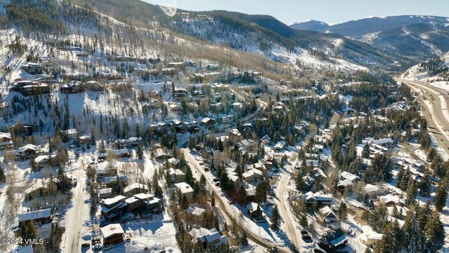 snowy aerial view with a mountain view