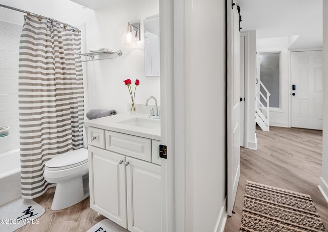 4480 Timber Falls Ct Unit 1507, Vail, CO 81657 - bathroom with wood finished floors, vanity, toilet, and shower / tub combo with curtain