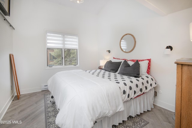 4480 Timber Falls Ct Unit 1507, Vail, CO 81657 - bedroom with wood finished floors, a baseboard heating unit, and baseboards