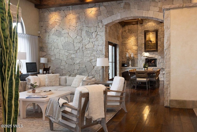 living room featuring hardwood / wood-style floors and a high ceiling