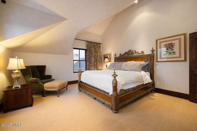 bedroom with baseboards, carpet floors, and high vaulted ceiling