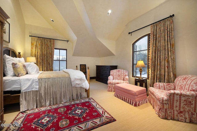 carpeted bedroom featuring vaulted ceiling