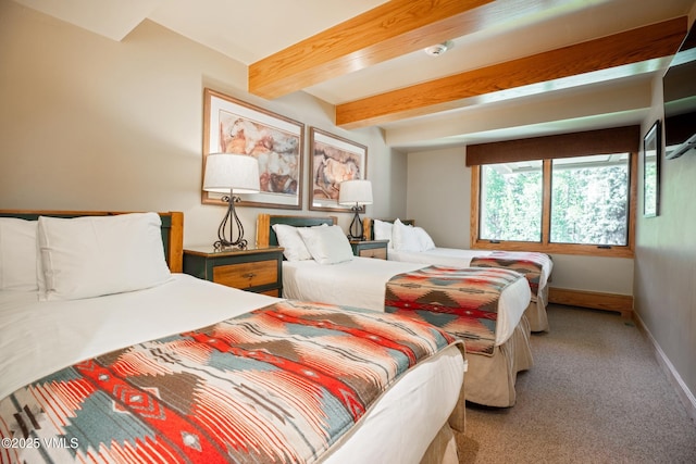 390 E Lionshead Cir Unit 406, Vail, CO 81657 - carpeted bedroom with beamed ceiling and baseboards