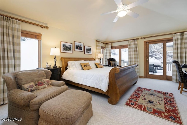 bedroom featuring a ceiling fan, light carpet, vaulted ceiling, and access to exterior