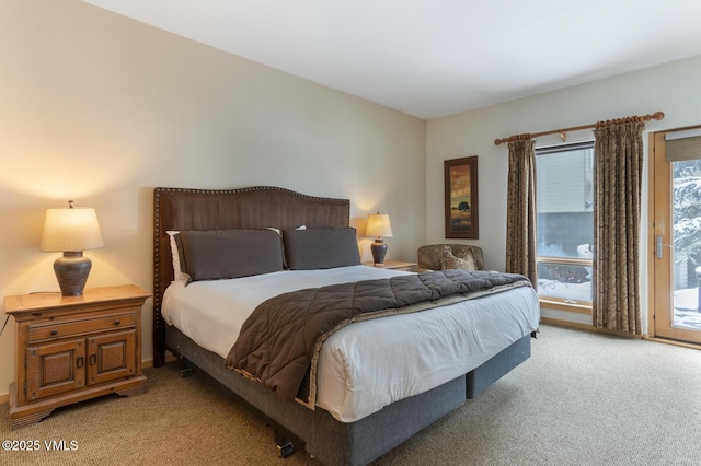 1230 Lions Ridge Loop Unit 2-D, Vail, CO 81657 - bedroom featuring light carpet and access to exterior