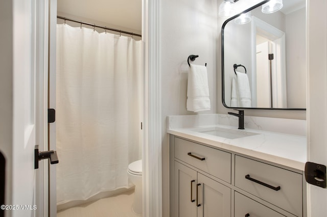full bath featuring toilet and vanity