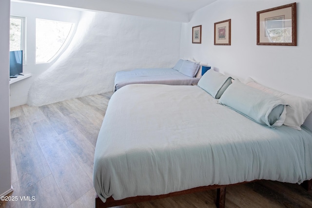 bedroom featuring wood finished floors