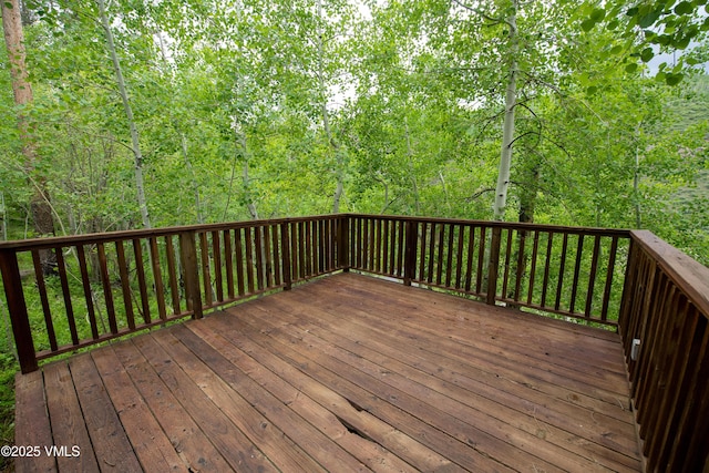 2940 Basingdale Blvd Unit 2, Vail, CO 81657 - wooden terrace with a wooded view