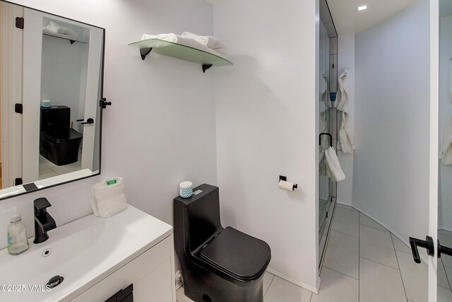 full bath featuring tile patterned floors, a stall shower, and vanity