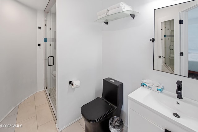 bathroom featuring tile patterned flooring, a shower stall, baseboards, toilet, and vanity