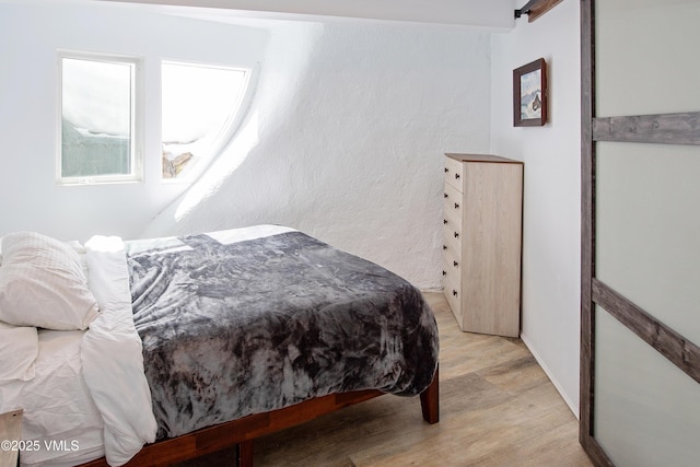 bedroom with light wood-style floors