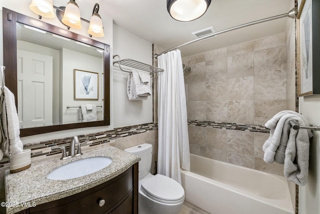 full bath with tile walls, visible vents, toilet, shower / tub combo, and vanity