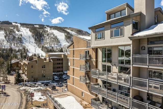 snow covered property featuring a mountain view