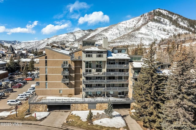 snow covered building with a mountain view