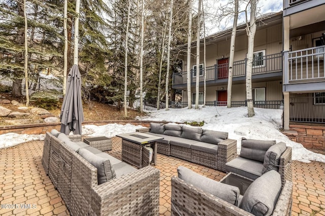 view of patio with a balcony and an outdoor hangout area