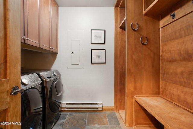 clothes washing area featuring washer and dryer, electric panel, cabinets, and baseboard heating