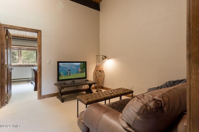 living room featuring light colored carpet and baseboard heating