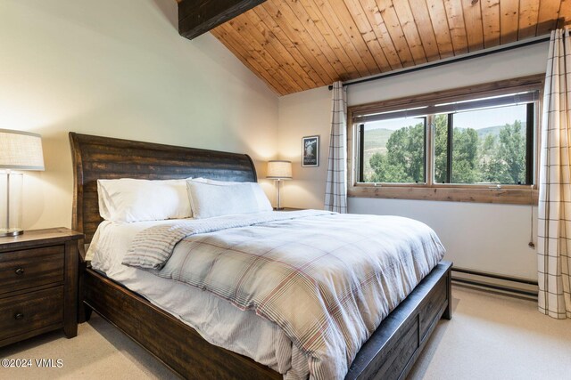 bedroom with lofted ceiling with beams, light carpet, wooden ceiling, and baseboard heating