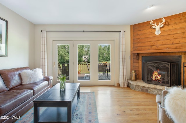 living room with a fireplace and light hardwood / wood-style floors