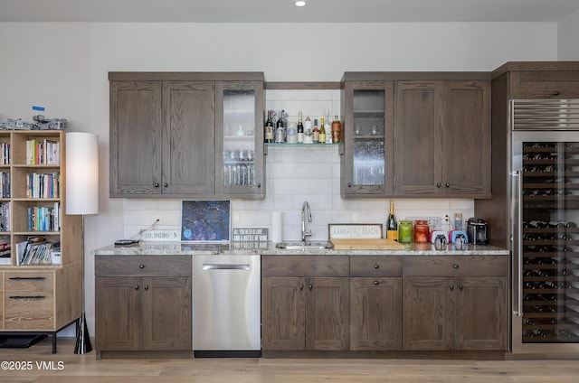 2682 E Haystacker Dr, Eagle, CO 81631 - indoor wet bar featuring dishwasher, wine cooler, backsplash, light wood-style flooring, and recessed lighting