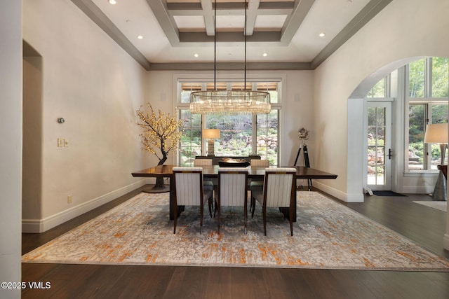 1724 Paintbrush, Avon, CO 81620 - dining space featuring wood-type flooring, arched walkways, baseboards, coffered ceiling, and a high ceiling