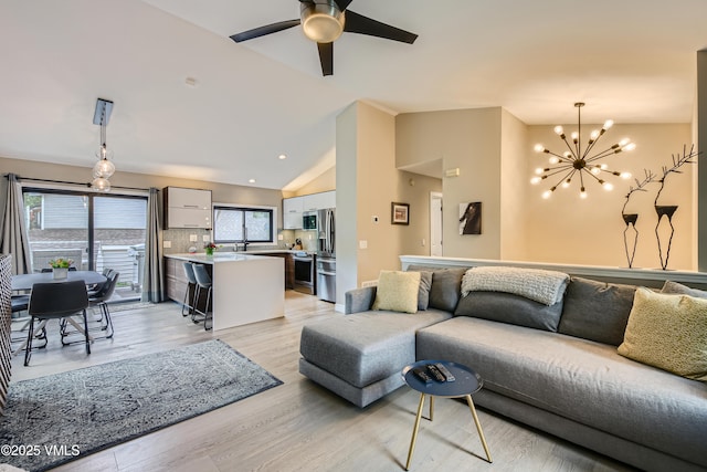 11 Spruce Cir, Edwards, CO 81632 - living room featuring vaulted ceiling, a chandelier, light wood-type flooring, ceiling fan, and recessed lighting