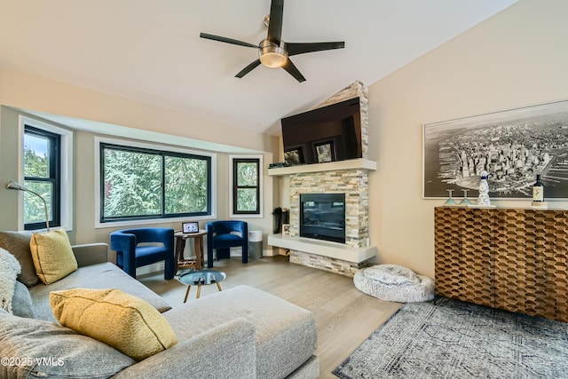 11 Spruce Cir, Edwards, CO 81632 - living room featuring ceiling fan, wood finished floors, a fireplace, and vaulted ceiling