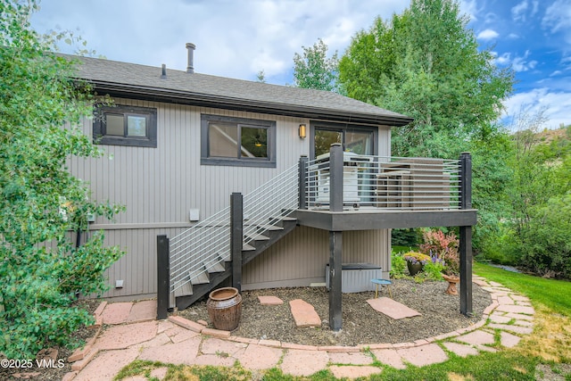 11 Spruce Cir, Edwards, CO 81632 - rear view of property featuring stairs, a shingled roof, and a deck