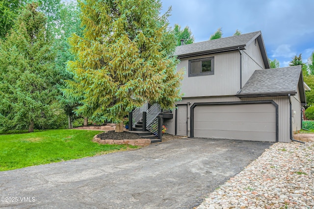 11 Spruce Cir, Edwards, CO 81632 - view of front facade with roof with shingles, driveway, stairway, a garage, and a front yard