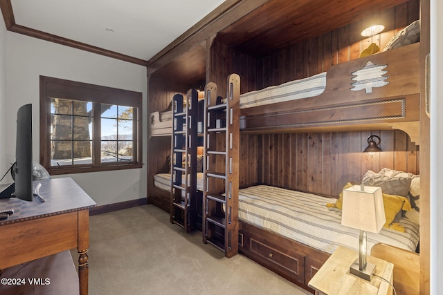 carpeted bedroom with ornamental molding