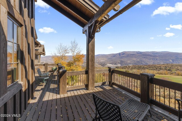 wooden terrace with a mountain view