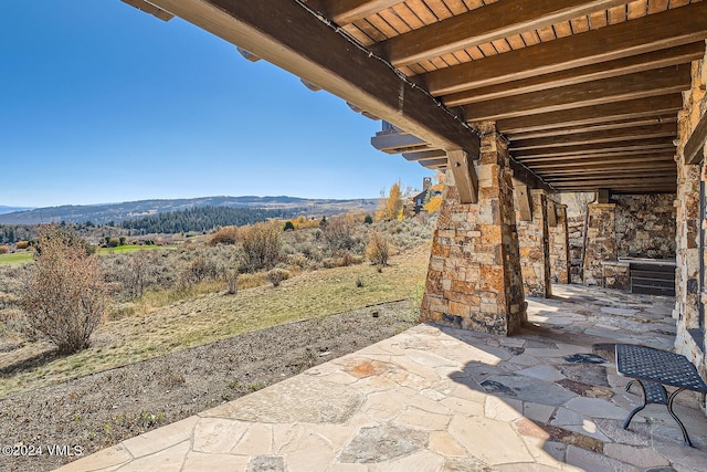 view of patio / terrace with a mountain view