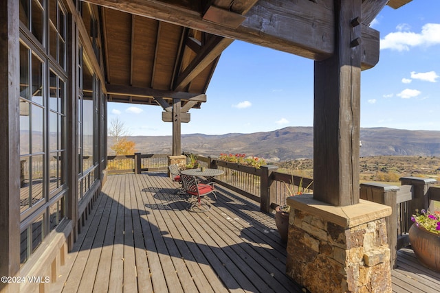 wooden deck featuring a mountain view