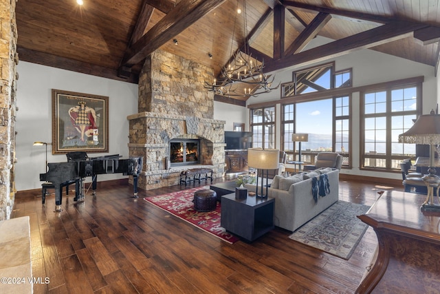 living room with beamed ceiling, a stone fireplace, hardwood / wood-style floors, and wooden ceiling