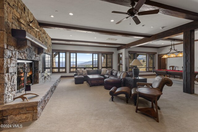 carpeted living room featuring a fireplace, beam ceiling, billiards, and a wealth of natural light