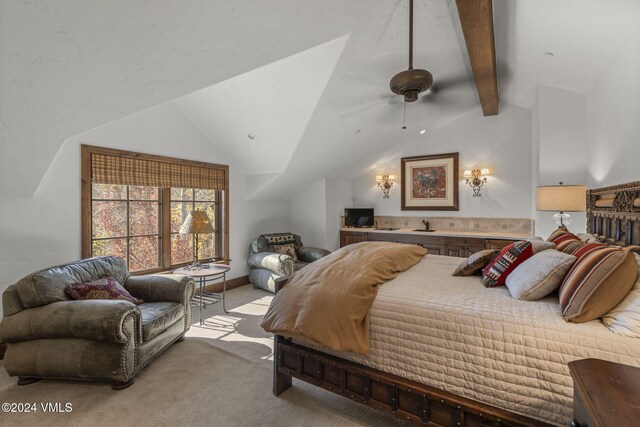 bedroom featuring lofted ceiling with beams, light colored carpet, and ceiling fan