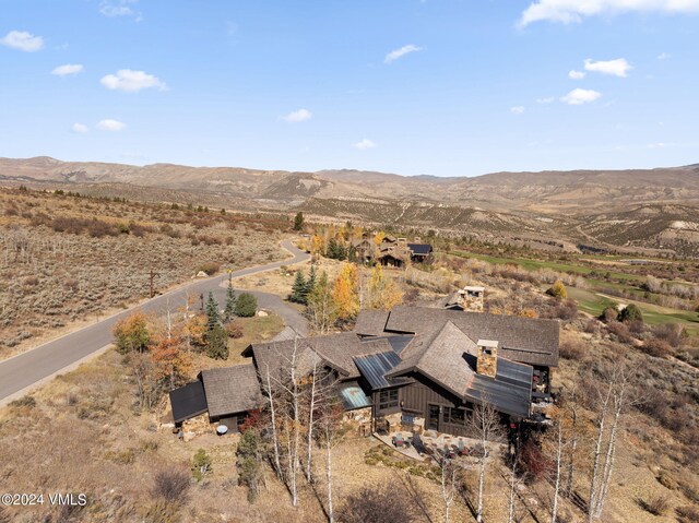 birds eye view of property with a mountain view