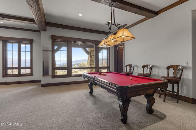 recreation room with beamed ceiling, crown molding, a mountain view, and carpet floors