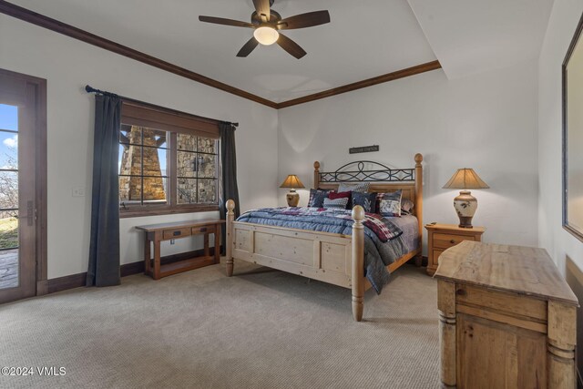 carpeted bedroom featuring ceiling fan, ornamental molding, and access to outside