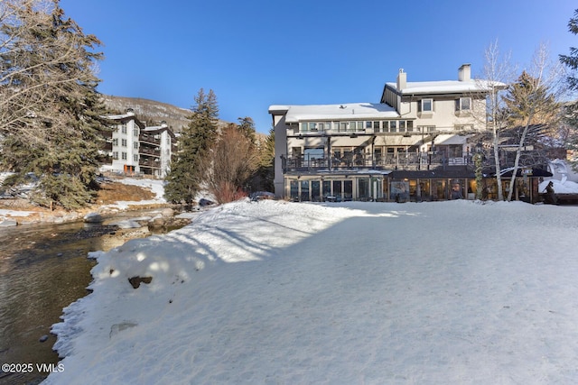 view of snow covered house