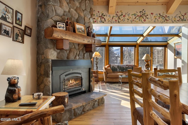 interior space with hardwood / wood-style flooring, a fireplace, and beam ceiling