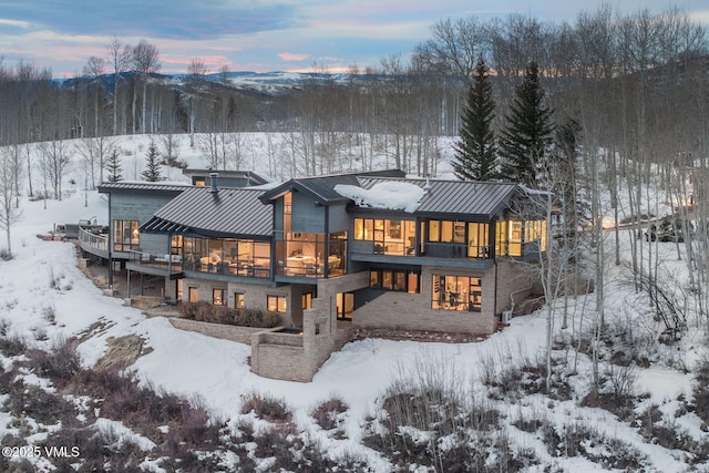 snow covered house with a balcony